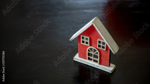 Vintage toy house on black wooden table