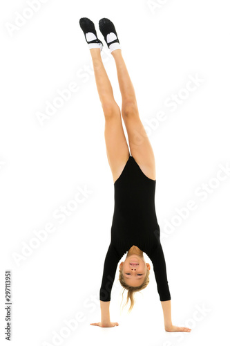 The gymnast performs a handstand with bent legs.