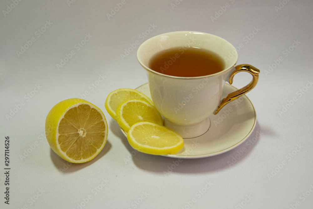 Porcelain white tea Cup isolated on white background. Limon. Tea party. Prevention of colds. Porcelain white tea Cup isolated on white background. Limon. Tea party. Prevention of colds.