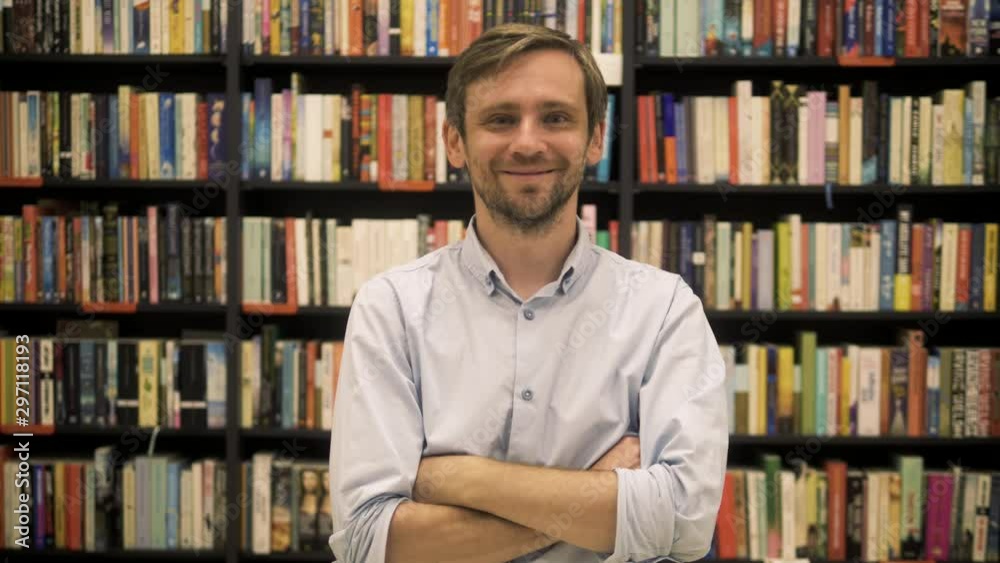 young student man portrait, after reading book in the library, happy business owner in book shop young student man portrait, after reading book in the library, happy business owner in book shop