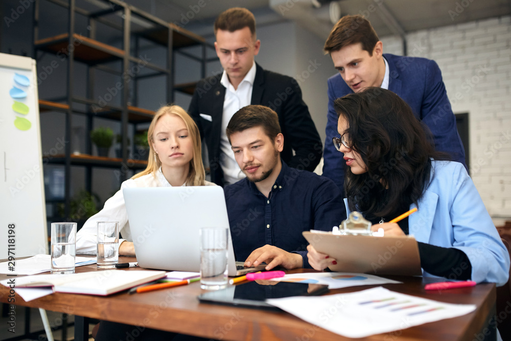 Group of successful clever business people analyzing and discussing problems at the meeting in the modern office room. close up photo. Group of successful clever business people analyzing and discussing problems at the meeting in the modern office room. close up photo.