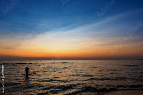 Scenic view of a summer sunset on the Ionian sea near Gallipoli, a town in the Apulian region (Italy). Landscape format.