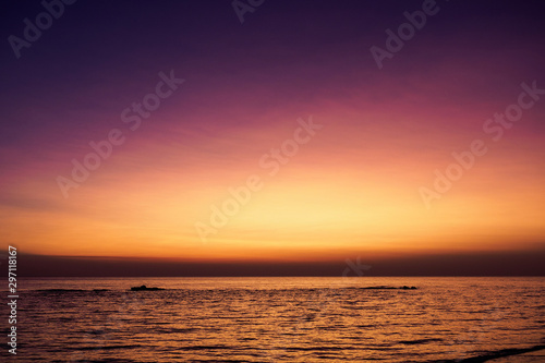 Scenic view of a summer sunset on the Ionian sea near Gallipoli, a town in the Apulian region (Italy). Landscape format.
