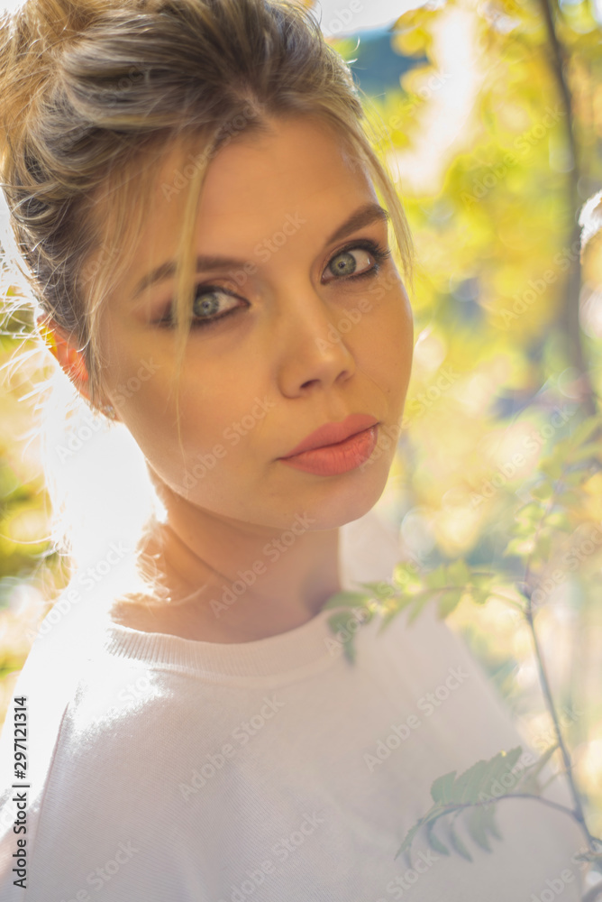 Young pregnant woman in nature enjoying autumn sun outdoors. Young pregnant woman in nature enjoying autumn sun outdoors.