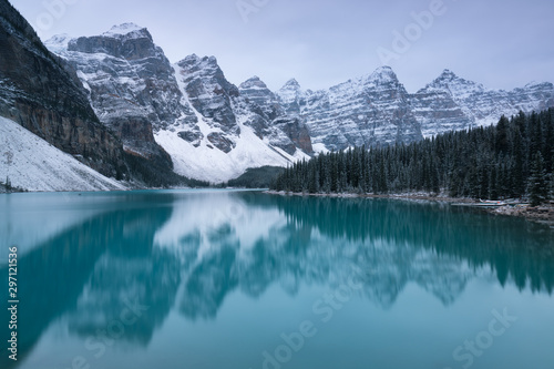 First snow Morning at Moraine Lake in Banff National Park Alberta Canada Snow-covered winter mountain lake in a winter atmosphere. Beautiful background photo