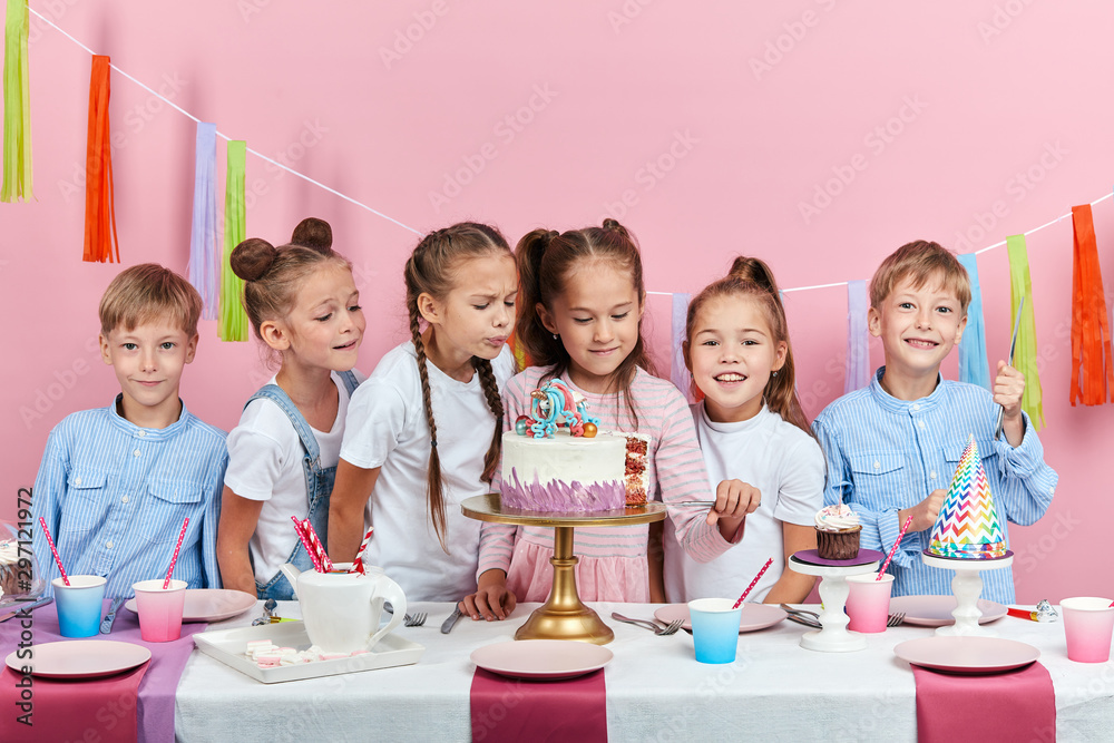 lovely girl giving porsions of cake at party. close up photo isolated pink background, studio shot lovely girl giving porsions of cake at party. close up photo isolated pink background, studio shot