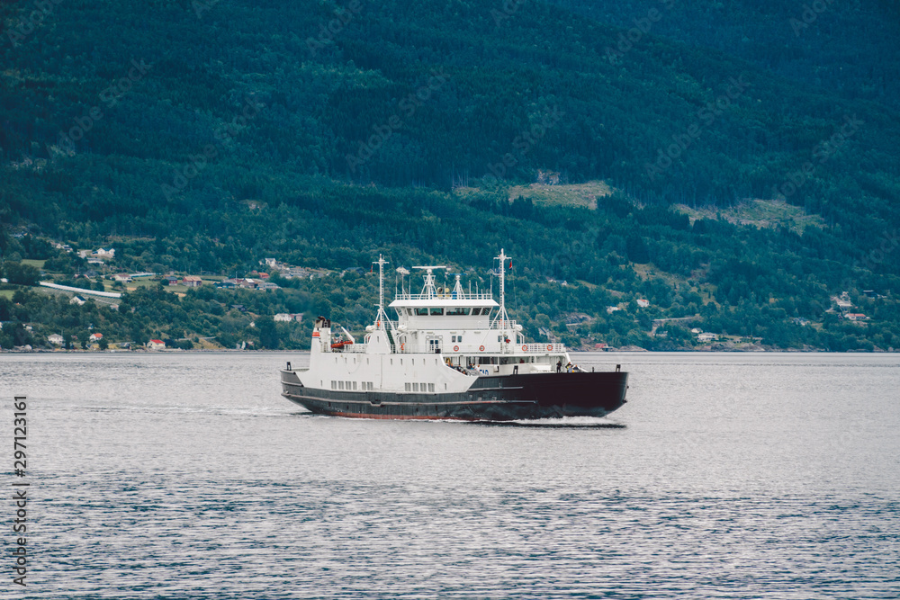 Ferry boat transportation Norway. White passenger ferry goes on fjord. In Norway. ferry crossing a fjord. Ferryboat cruising on Norwegian fjord