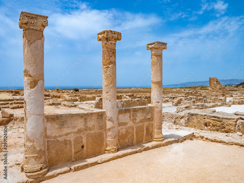 Island of Cyprus. Archaeological Park of Paphos. Three columns from an ancient building. Archaeological site on the Mediterranean coast. Fragments of ancient buildings. Sightseeing In Cyprus.