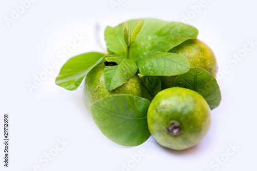 Fresh guava with leaf isolated on white background. © avs