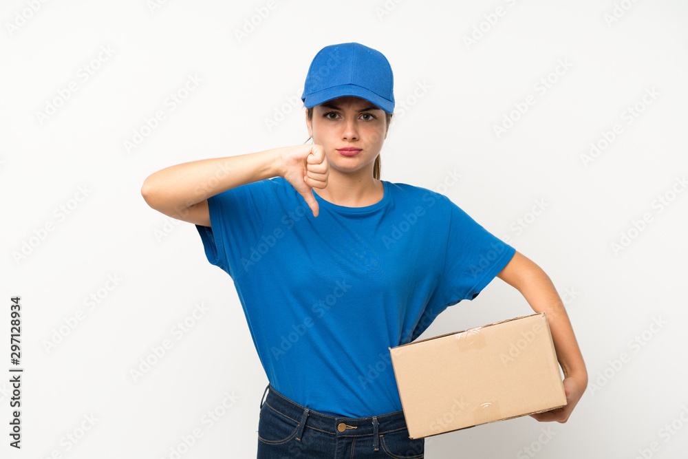 Young delivery girl over isolated white background showing thumb down sign Young delivery girl over isolated white background showing thumb down sign
