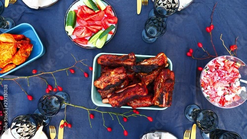 tomatoes salad with cheese and other food with glasses on a table photo