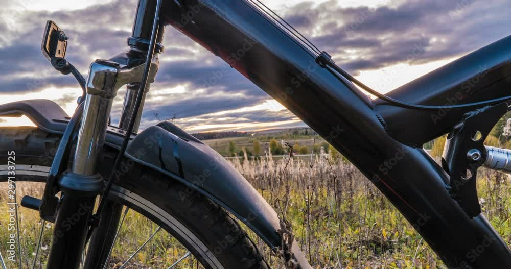 camera movement along the bicycle against the setting sun, beautiful landscape, time lapse, hyperlapse camera movement along the bicycle against the setting sun, beautiful landscape, time lapse, hyperlapse