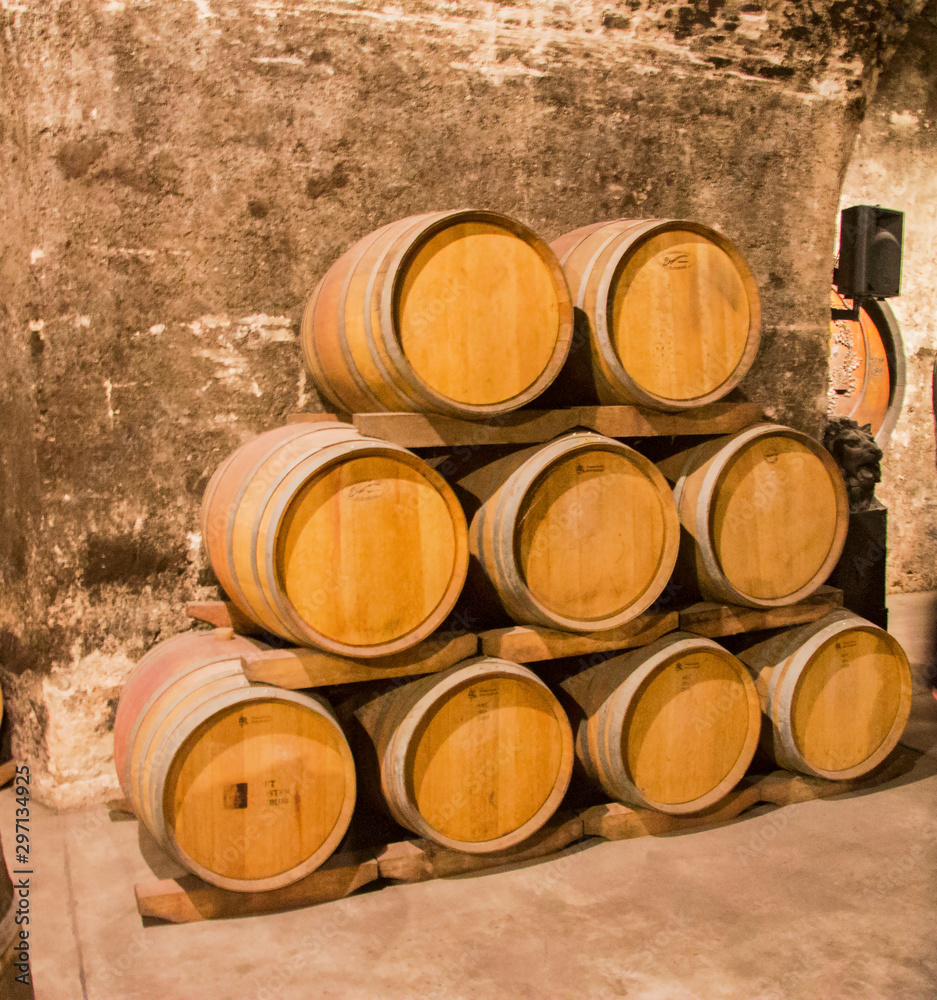 Old wooden barrels in the wine cellar of monastery