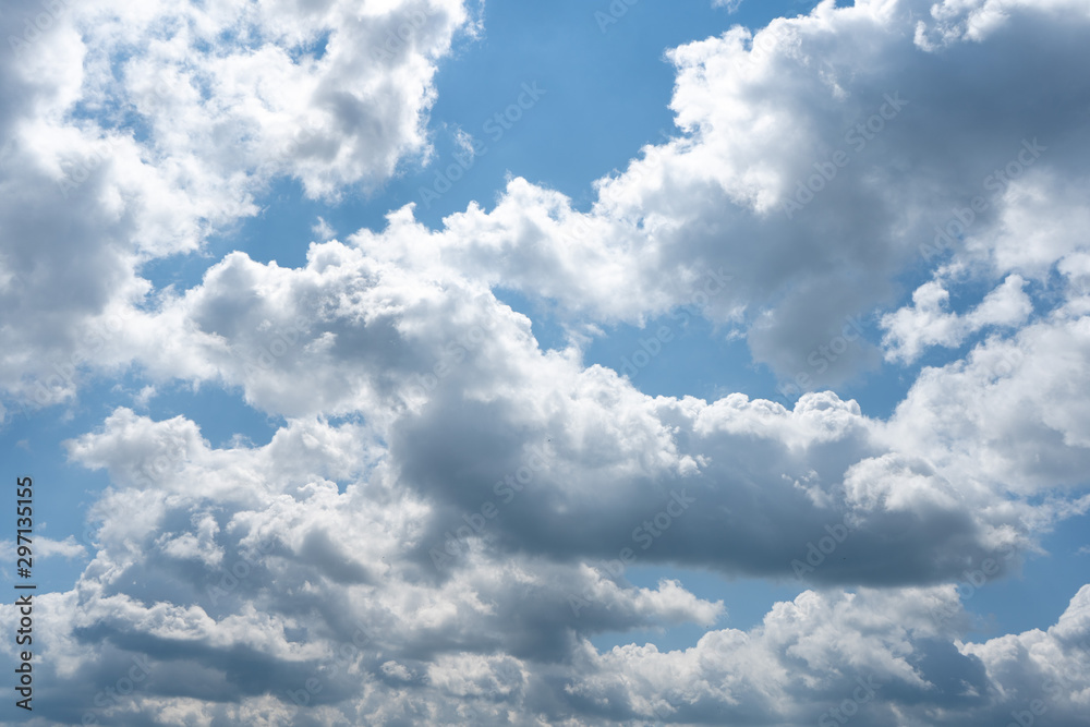 Glowing clouds on a background of blue sky. White fluffy luminous cloud Glowing clouds on a background of blue sky. White fluffy luminous cloud