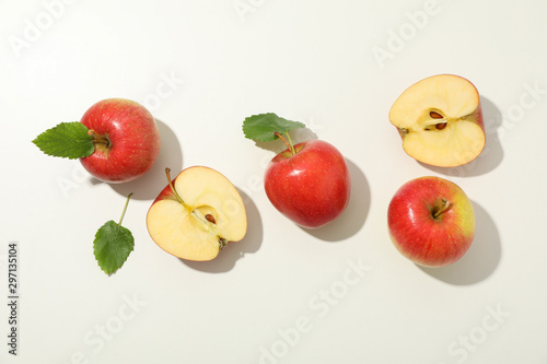 Flat lay with red apples on white background, space for text