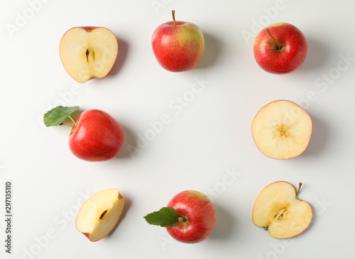 Fototapeta Naklejka Na Ścianę i Meble -  Flat lay with red apples on white background, space for text