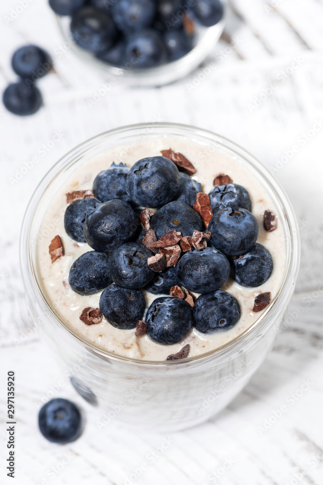 bircher muesli with fresh blueberries on white table, top view closeup bircher muesli with fresh blueberries on white table, top view closeup