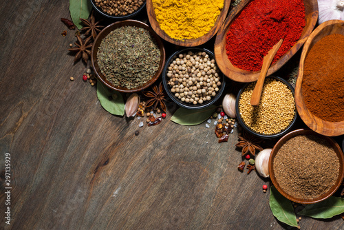 Fototapeta Naklejka Na Ścianę i Meble -  assortment of various spices on a wooden table