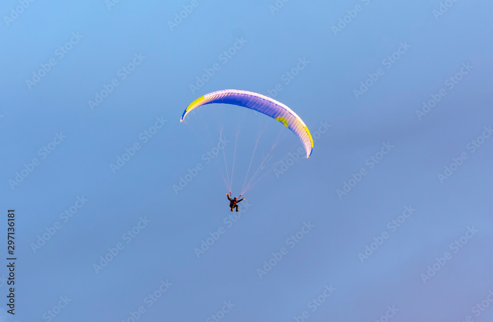 Extreme sport paragliding, at sunset Extreme sport paragliding, at sunset
