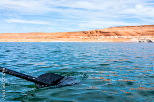 Lake Powell kayaking activity rental boat low angle view of paddle oar and canyons water on summer sunny day