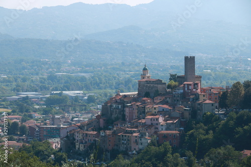 Village of Arcola with the pentagonal tower and in the background the valley of the Magra river and the Apuan Alps. photo