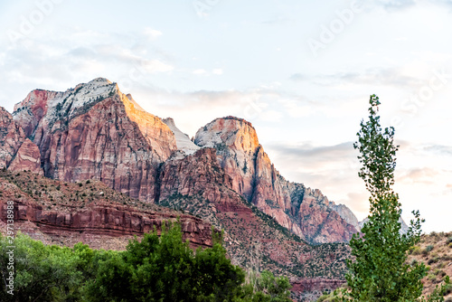 Zion National Park in Utah with landscape view of sunrise at red pink formation rock cliffs near Watchman Campground and Visitor Center