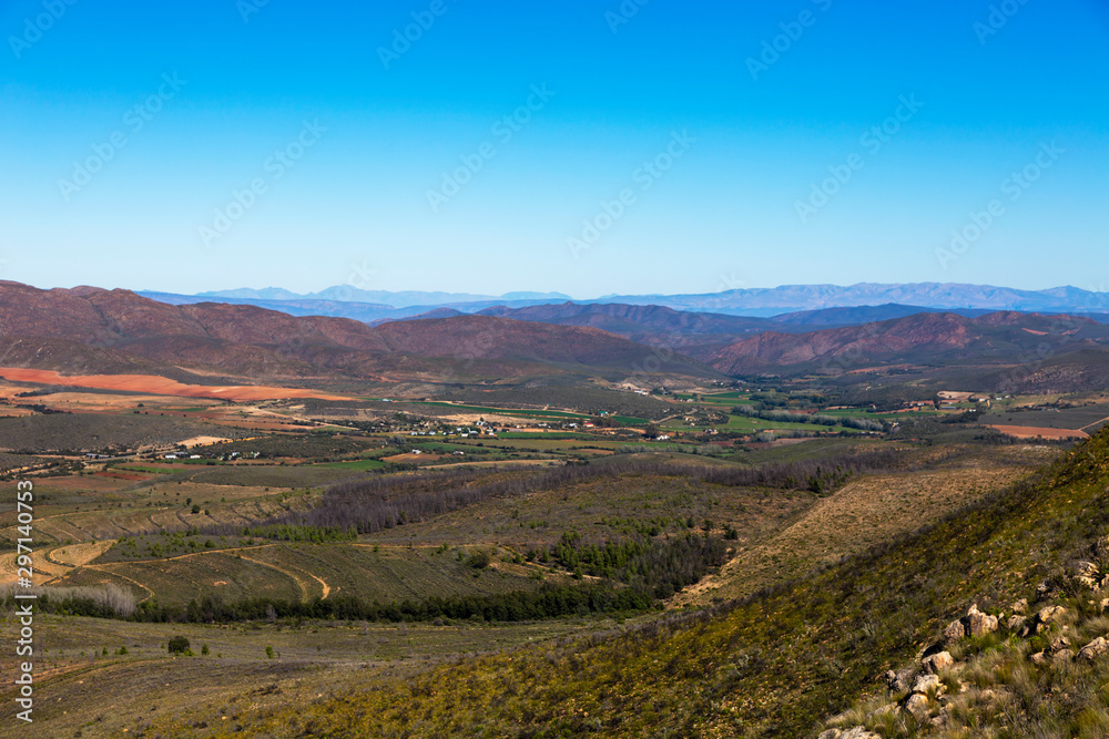 Green pastures in the valley between the mountains