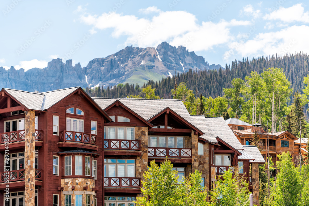 Telluride, Colorado small town Mountain Village in summer 2019 with view of San Juan Mountains and modern resort lodge apartment condo architecture - obrazy, fototapety, plakaty 