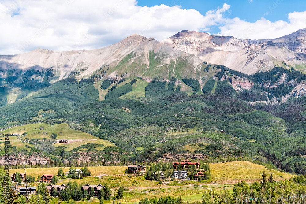 Aerial high angle view of rocky San Juan mountains from Telluride, Colorado with beautiful valley and Mountain Village houses on summer day