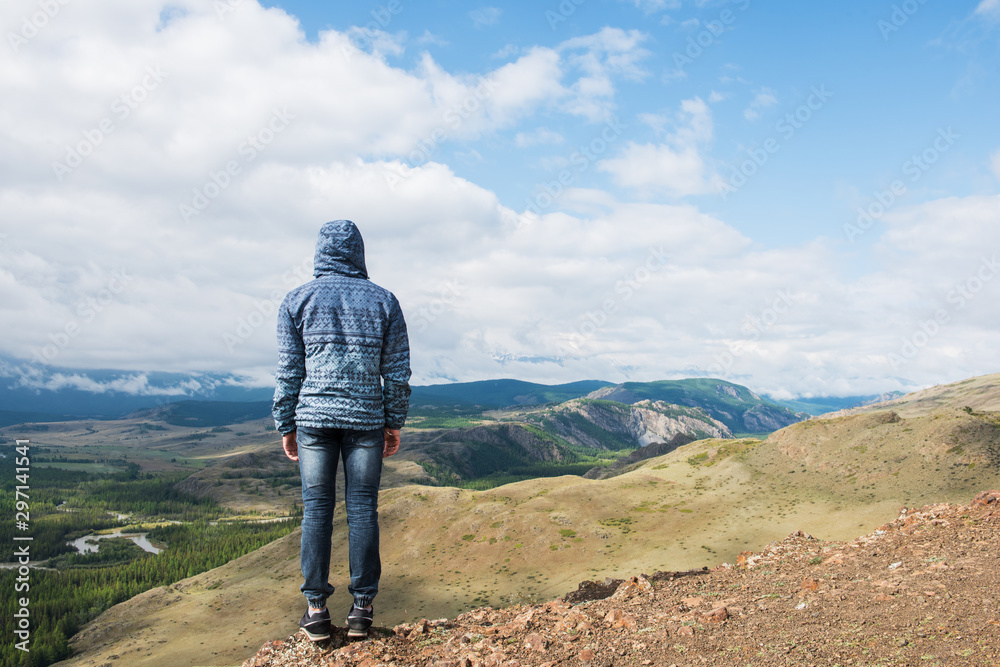 Fototapeta premium Man watching to glacier in Altai mountains. Resting in mountains or global warming concept