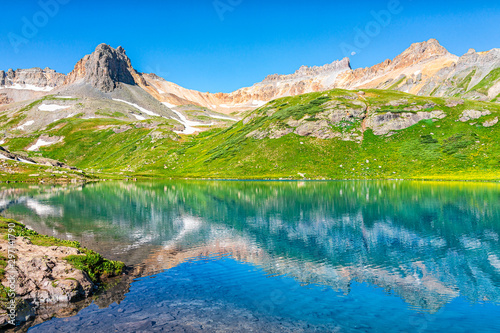 Fototapeta Naklejka Na Ścianę i Meble -  Landscape view of turquoise vibrant Ice lake near Silverton, Colorado on summit rocky mountain peak and snow in August 2019 summer