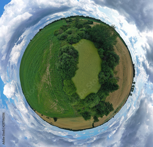 Fototapeta Naklejka Na Ścianę i Meble -  360 degree spherical drone aerial panoramic view on agricultural landscape with swamp pond, trees, fields and meadow.