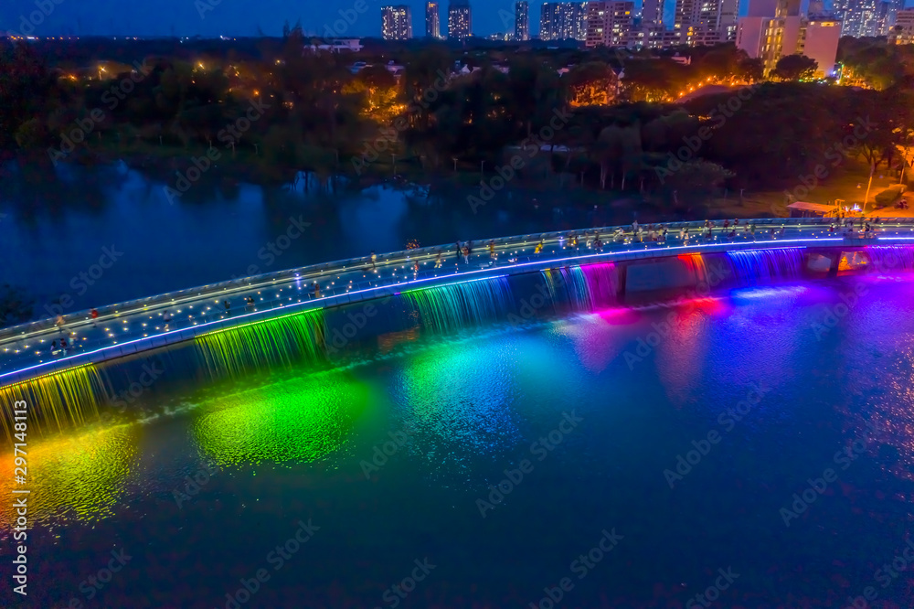 Aerial view of Starlight Bridge or Anh Sao Bridge which is a pedestrian bridge with colored lights and waterfall in District 7 of Ho Chi Minh City also known as Saigon, Vietnam. Aerial view of Starlight Bridge or Anh Sao Bridge which is a pedestrian bridge with colored lights and waterfall in District 7 of Ho Chi Minh City also known as Saigon, Vietnam.