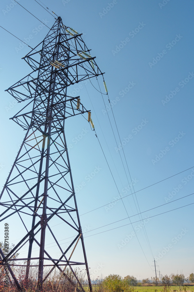 Power lines with various poles and supports, the appearance of an electrical transformer booth. Power lines with various poles and supports, the appearance of an electrical transformer booth.