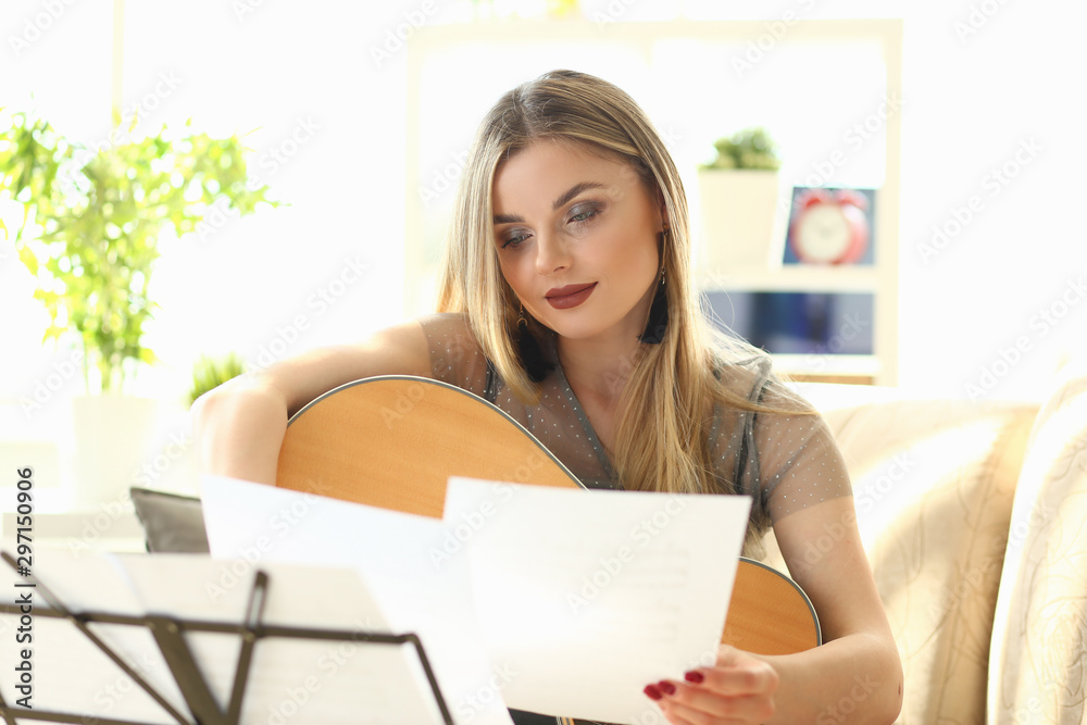Millennial beautiful woman play guitar Millennial beautiful woman play guitar