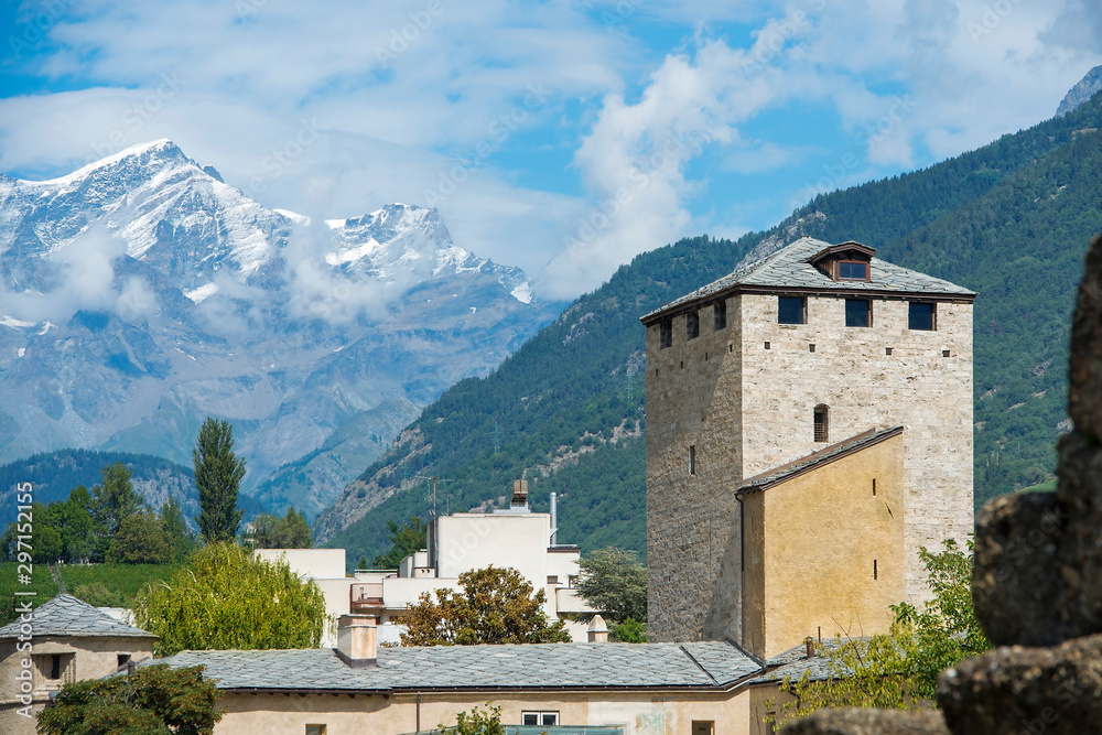 watch tower at the ancient Roman remains of the city of Aosta and in the background the Mont Blanc - Italy