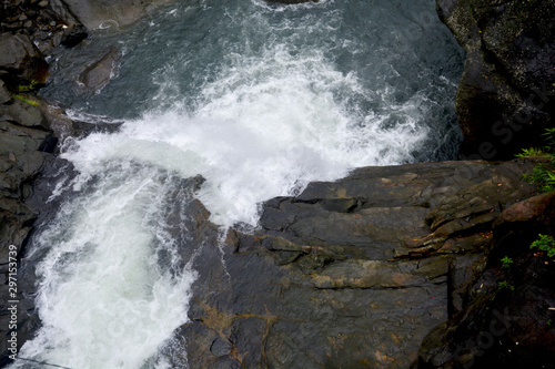 Close up of waterfall in Shillong in motion blurr  and rocks, selective focusing © RUPAK