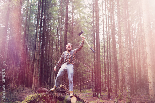 A bearded lumberjack with a large ax photo