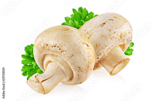 Two champignon mushrooms with parsley isolated on white