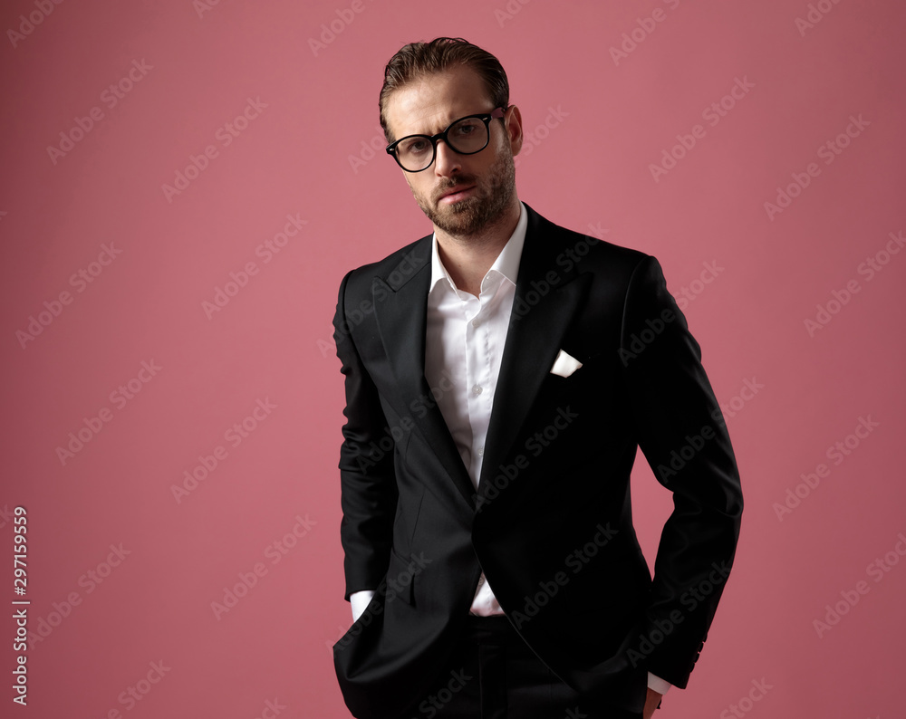 Serious man looking forward with his hands in his pockets Serious man looking forward with his hands in his pockets