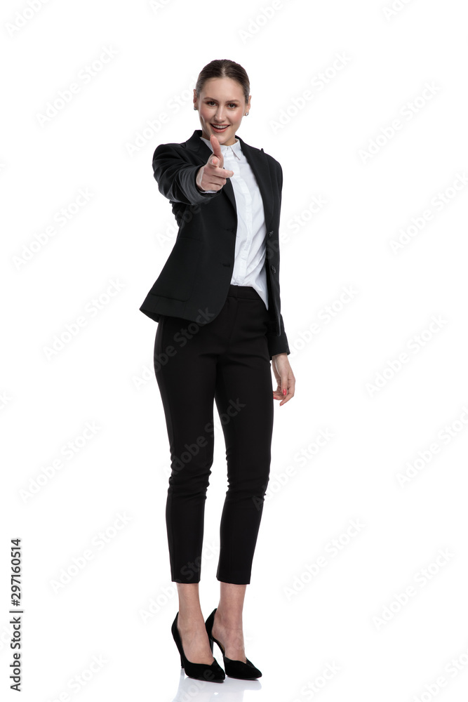 businesswoman standing and pointing forward happy businesswoman standing and pointing forward happy