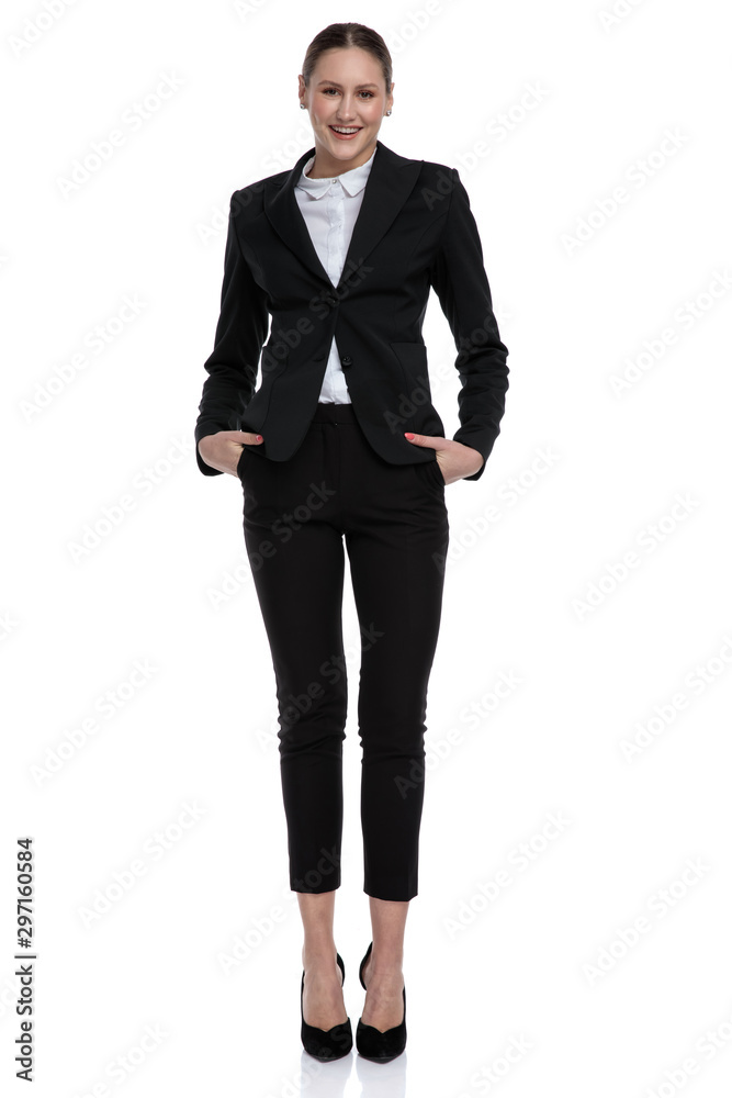 businesswoman standing with hands in pockets carefree businesswoman standing with hands in pockets carefree