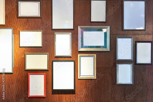 Fototapeta Naklejka Na Ścianę i Meble -  Empty picture frames on a wall for displaying certificates, award, accomplishments, pieces of art, copy space