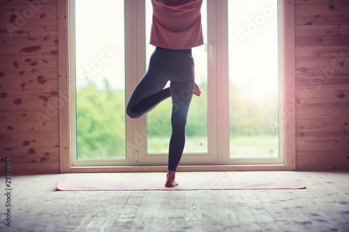 Girl in yoga poses on the floor