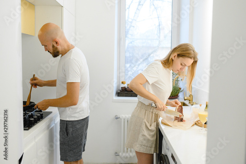 young couple making Breakfast in the morning. Young family. relationship 