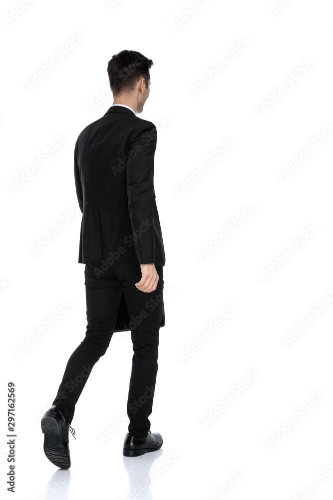 Rear view of a motivated businessman holding a briefcase Rear view of a motivated businessman holding a briefcase