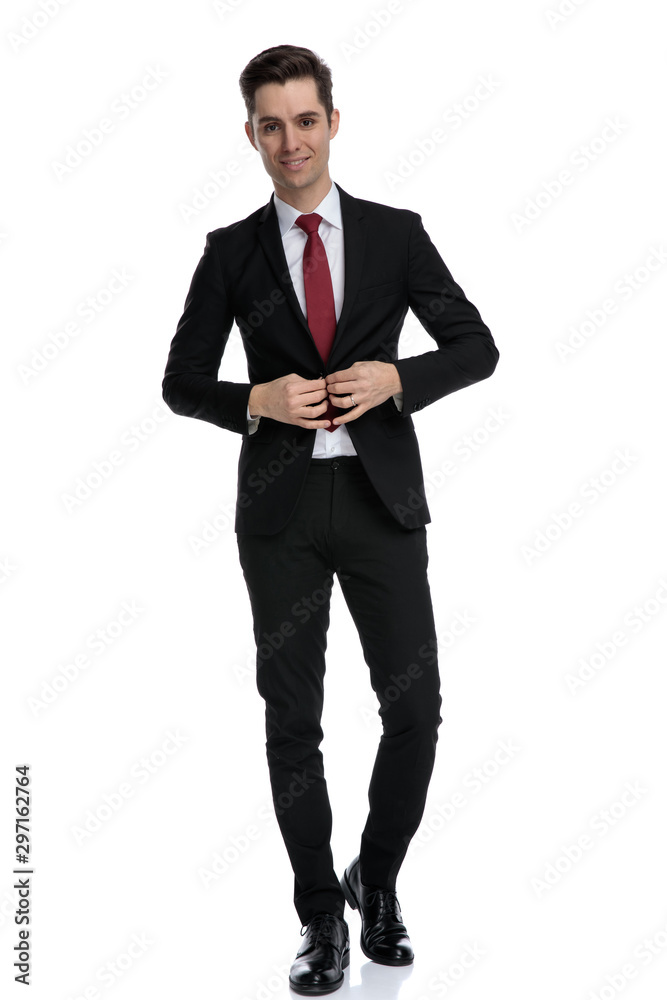Cheerful businessman unbuttoning his jacket Cheerful businessman unbuttoning his jacket