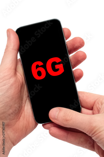 Male hand holding a smartphone with text 6G