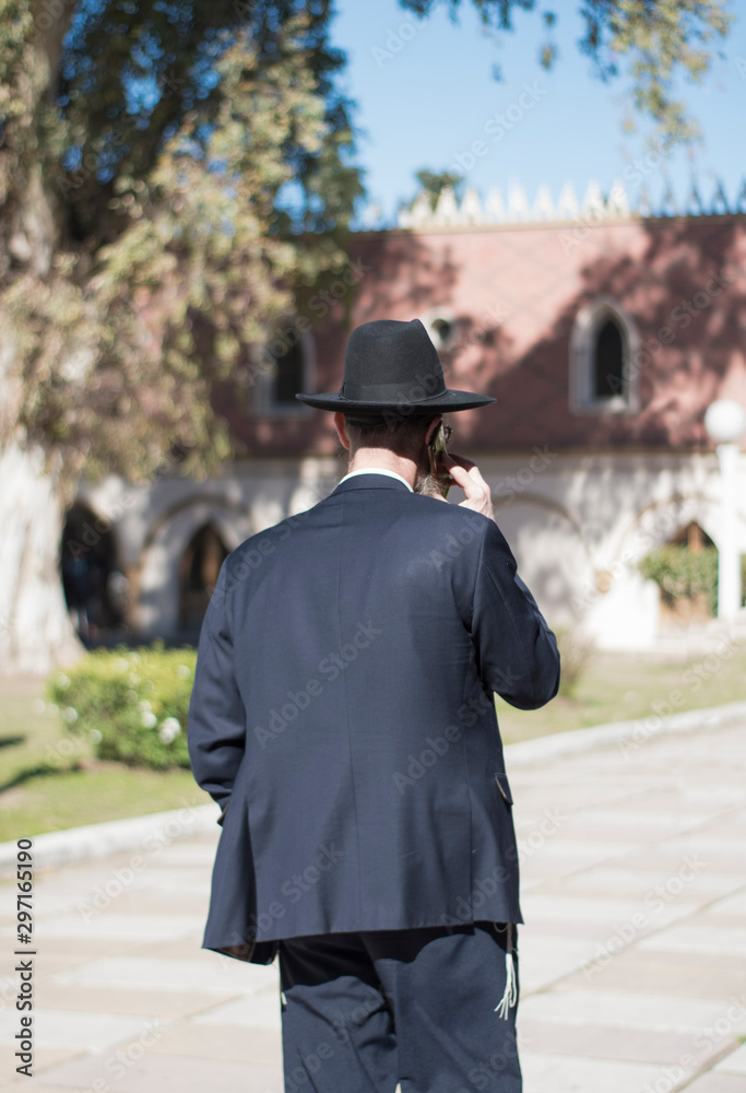 Jewish man speaking on the phone