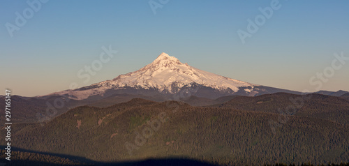 Mount Hood Covered in Snow, active stratovolcano and highest mountain in Oregon. Panoramic View from Sherrard Point, Fire Lookout at the top of Larch Mountain. Sunset, Glowing Summit